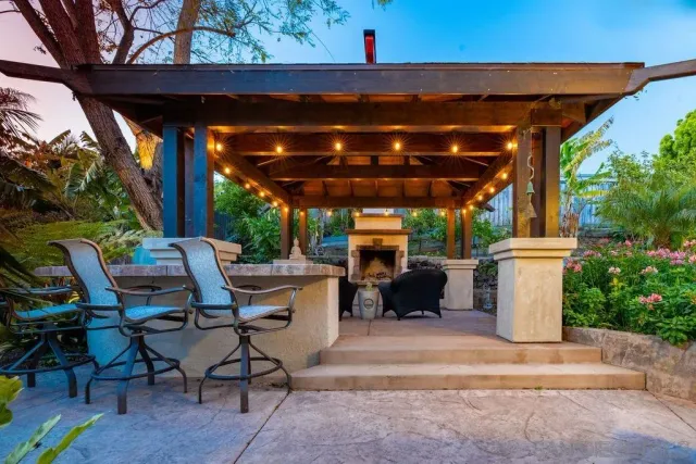 a view of a chairs and table in the patio