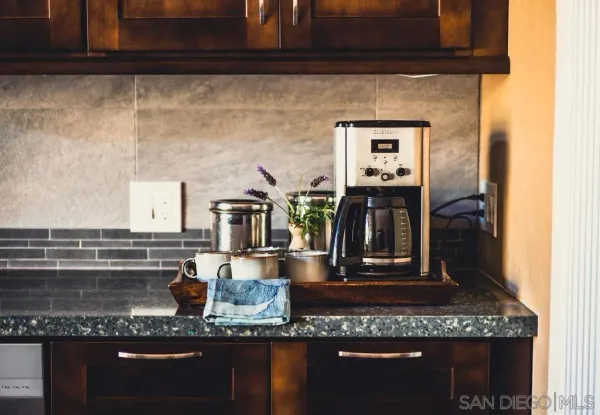 a view of living room with furniture and wooden floor