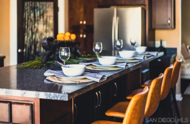 a kitchen with a table and chairs