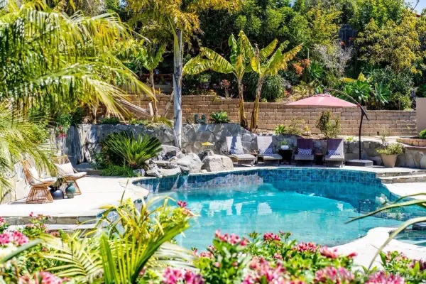 a view of a swimming pool with a patio