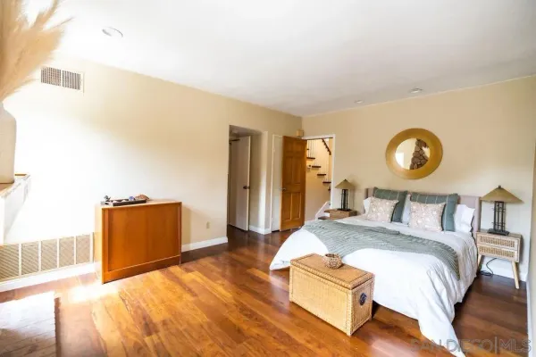 a bed room with a bed and a dresser