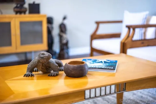 a room with a bed and a painting on the wall