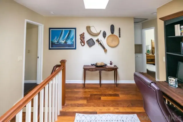 a view of a livingroom with furniture and staircase