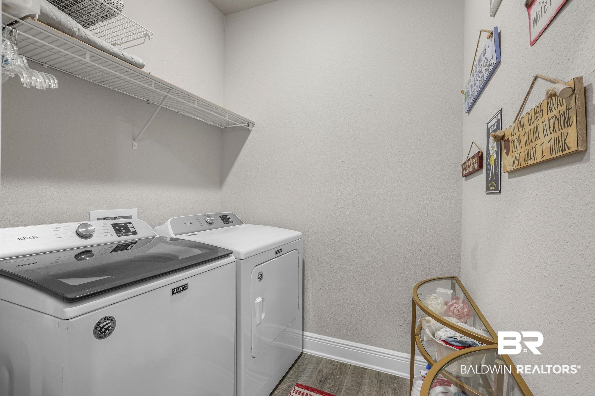 9056 Impala Drive Foley, AL 36535 - Photo 18 of 22 Laundry area featuring dark wood-type flooring and independent washer and dryer
