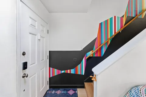 a view of an entryway with a stairs