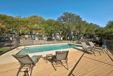 a view of a patio with table and chairs and wooden floor