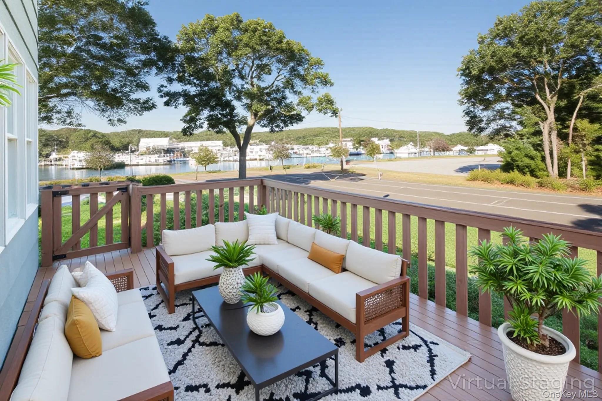 1 Canal Road Hampton Bays, NY 11946 - Photo 33 of 50 Virtually Staged Deck featuring an outdoor hangout area and a water view
