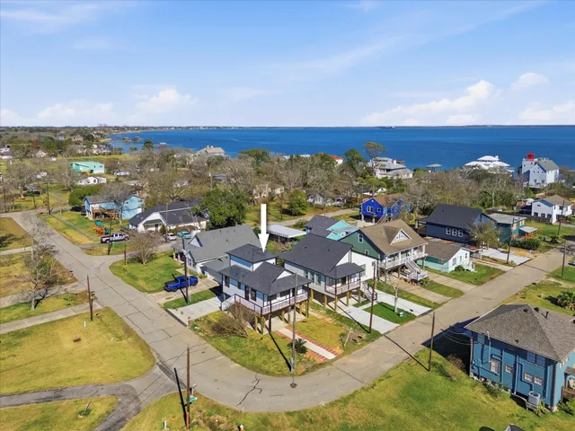 an aerial view of a house with a ocean view