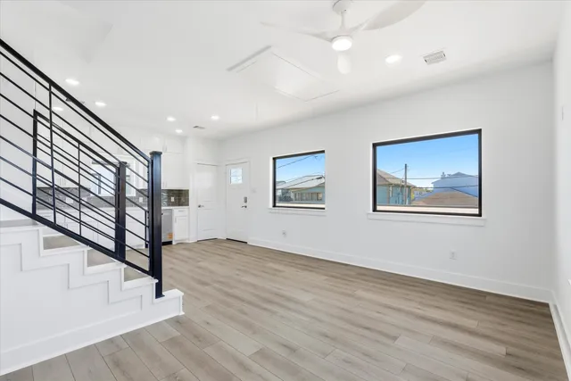 a view of an entryway with wooden floor