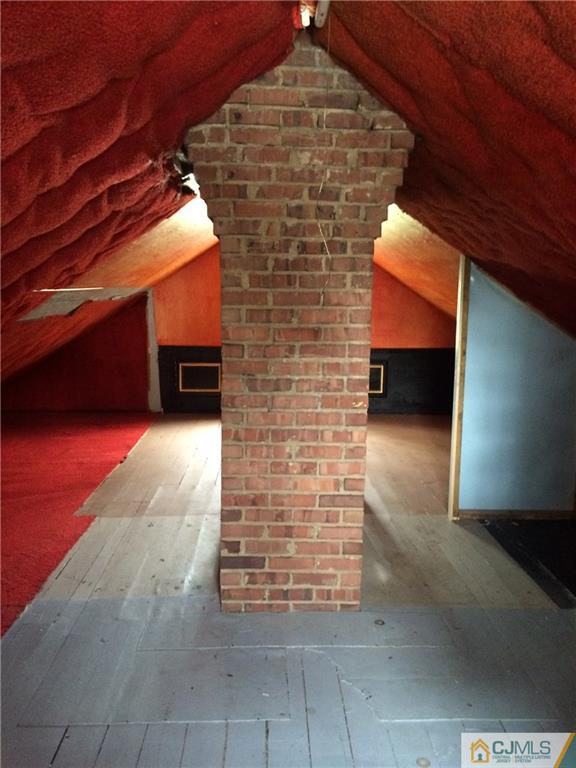 95 Westons Mill Road East Brunswick, NJ 08816 - Photo 15 of 22 a view of an empty room with brick wall