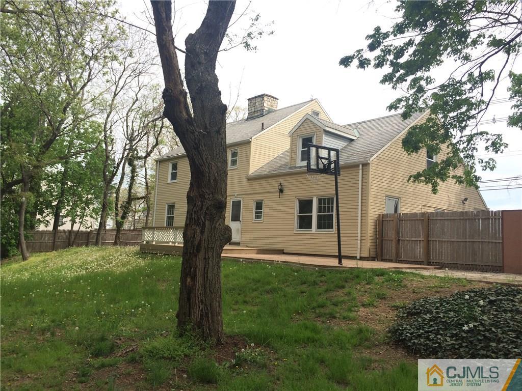 95 Westons Mill Road East Brunswick, NJ 08816 - Photo 21 of 22 a front view of a house with a yard