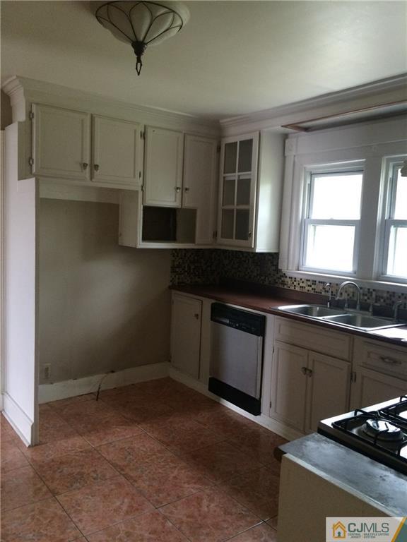 95 Westons Mill Road East Brunswick, NJ 08816 - Photo 4 of 22 a kitchen that has a sink cabinets and window