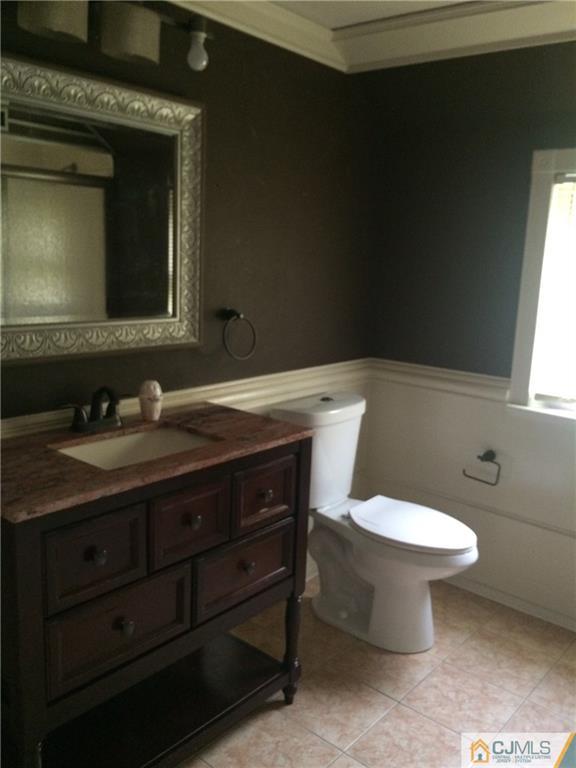 95 Westons Mill Road East Brunswick, NJ 08816 - Photo 5 of 22 a bathroom with a sink toilet and mirror