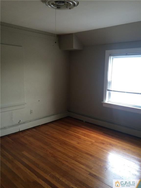 95 Westons Mill Road East Brunswick, NJ 08816 - Photo 9 of 22 a view of an empty room and window