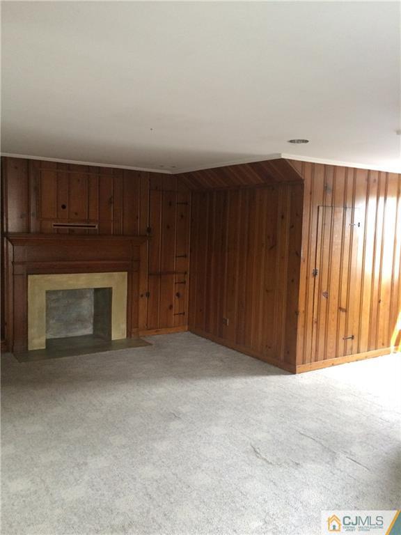 95 Westons Mill Road East Brunswick, NJ 08816 - Photo 10 of 22 a view of an empty room with a fireplace