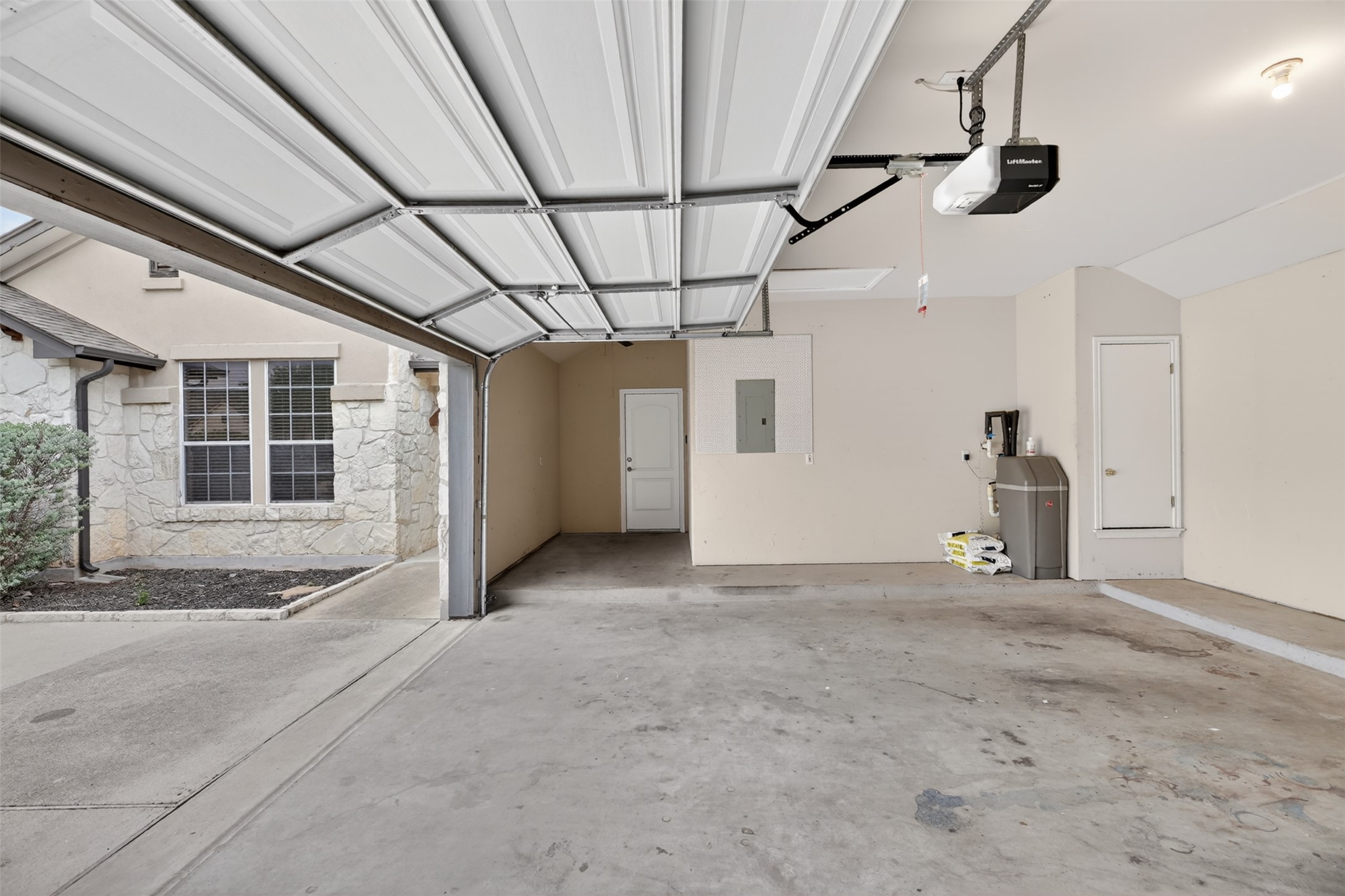 545 Manchester Lane Austin, TX 78737 - Photo 27 of 30 a view of a garage