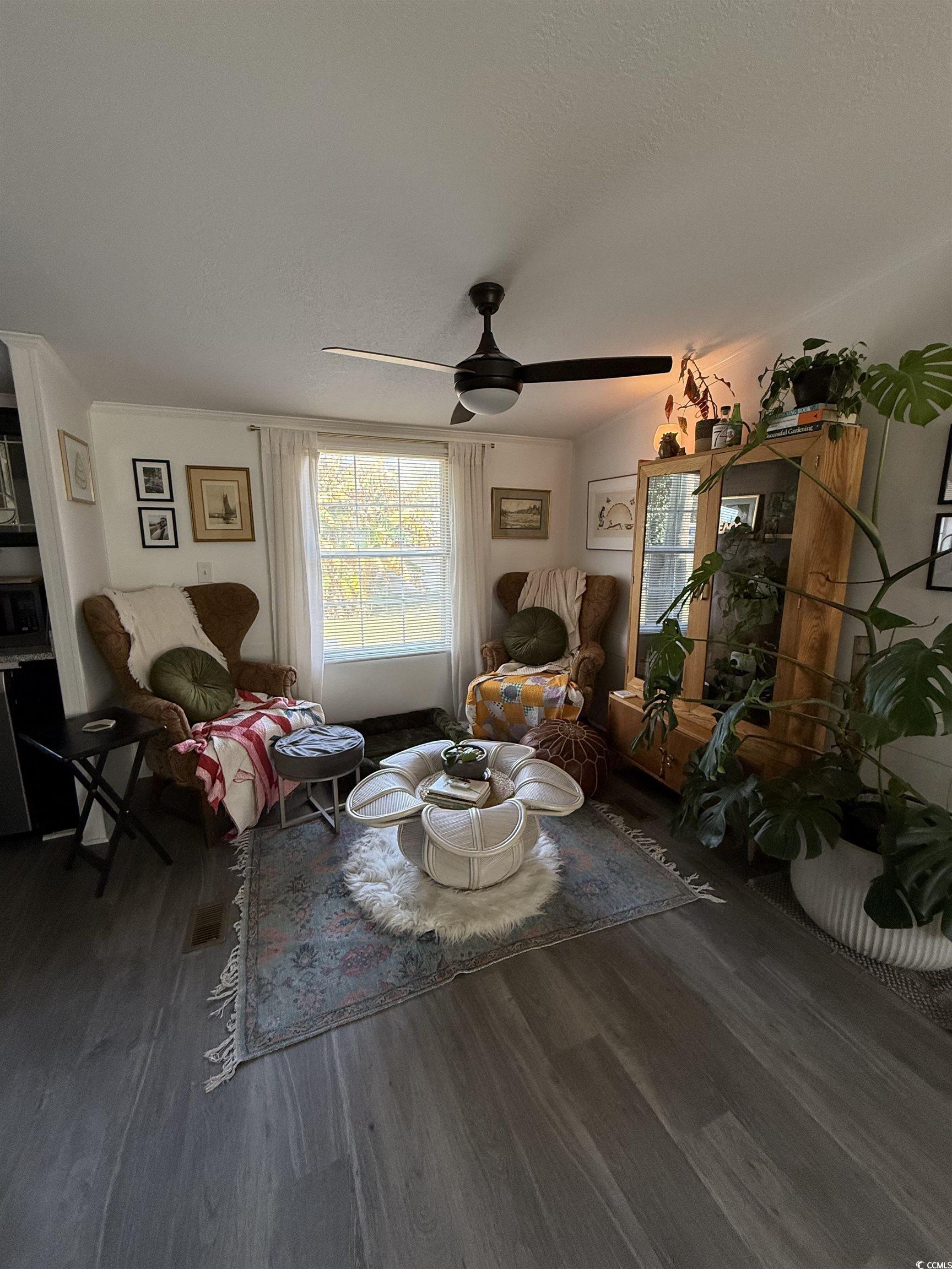 19 Gates Way Pawleys Island, SC 29585 - Photo 10 of 18 Living area with wood finished floors, a ceiling fan, and a textured ceiling