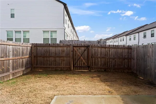a view of outdoor space with wooden fence