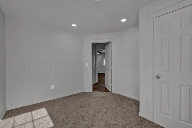 a view of an empty room and closet