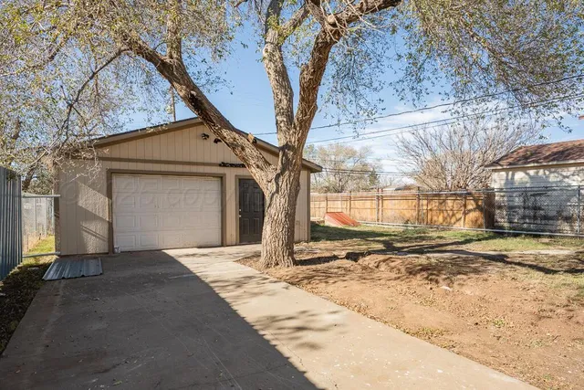 a view of a house with snow on the road