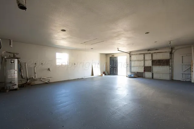 an empty room with a empty space and windows