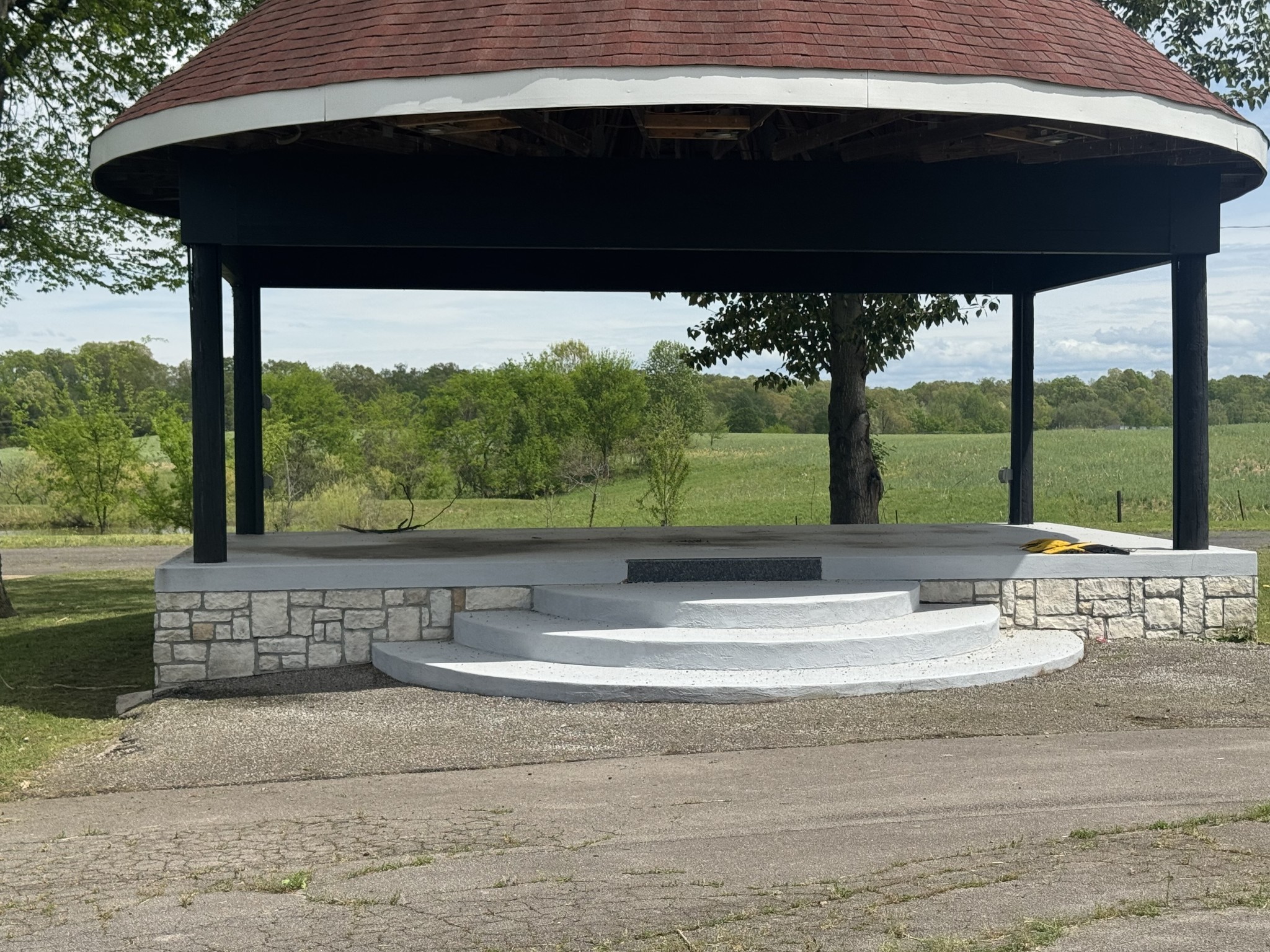 2982 Harvey Bowden Road Springville, TN 38256 - Photo 31 of 48 a view of a roof deck with a table and chairs under an umbrella
