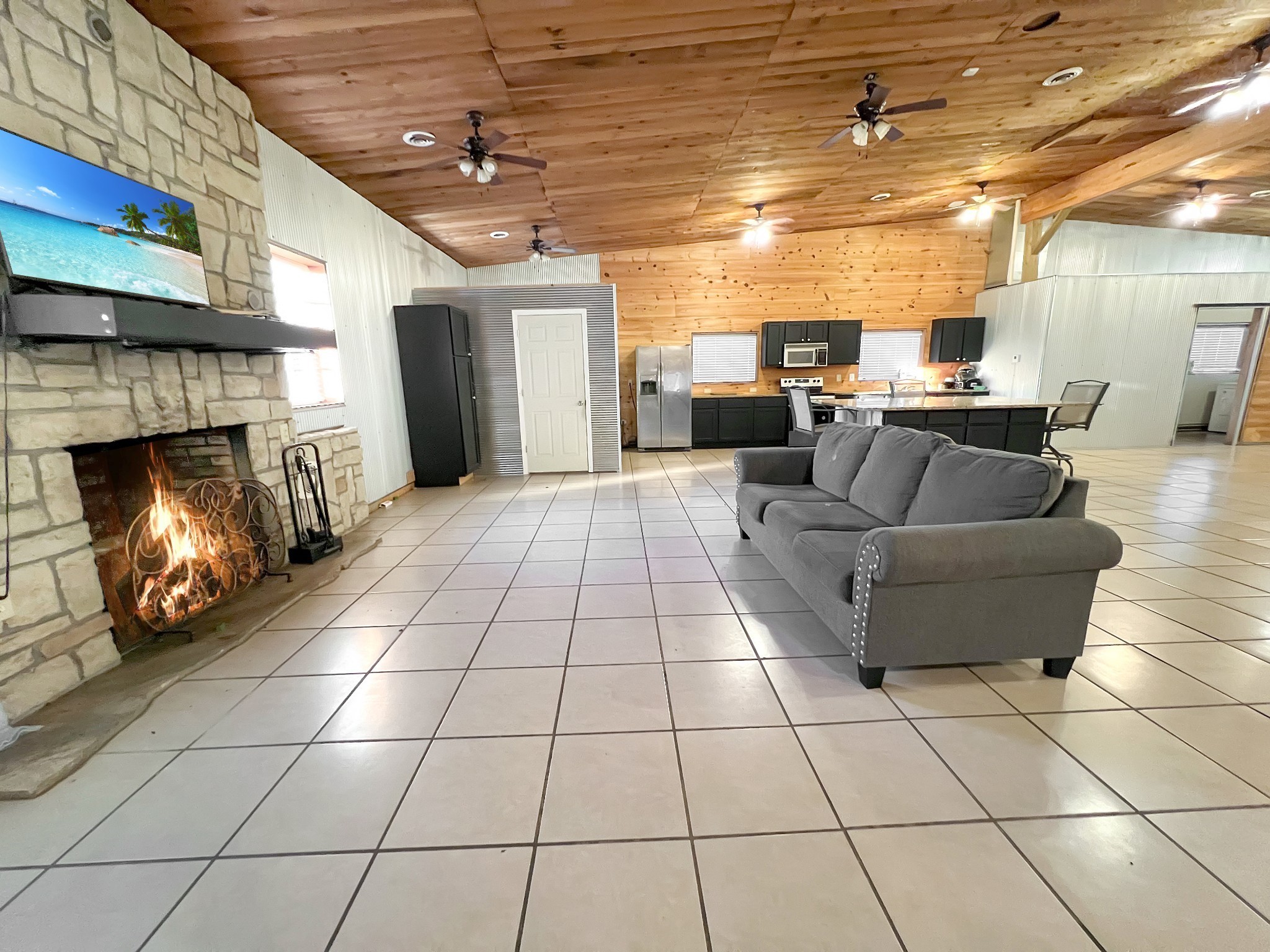 2982 Harvey Bowden Road Springville, TN 38256 - Photo 38 of 48 a living room with patio furniture and a fireplace