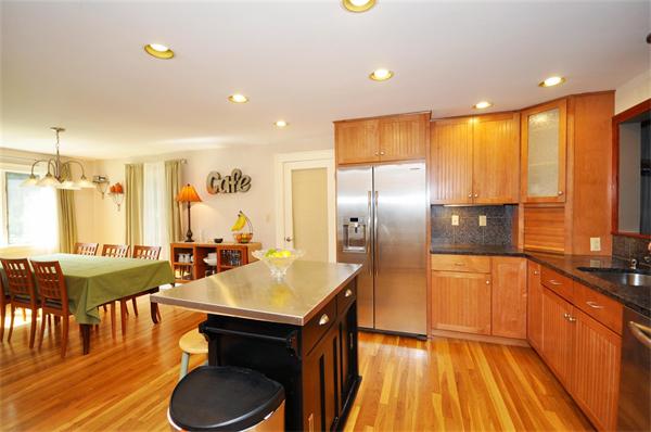 65 Columbia Road Arlington, MA 02474 - Photo 11 of 30 a kitchen with sink refrigerator and cabinets