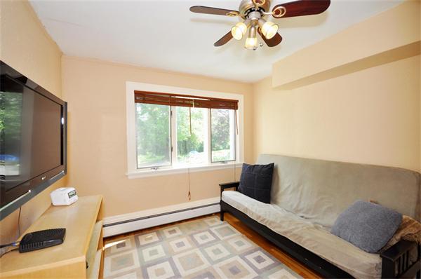 65 Columbia Road Arlington, MA 02474 - Photo 14 of 30 a living room with furniture and a flat screen tv