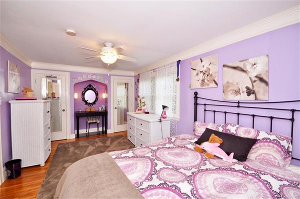 65 Columbia Road Arlington, MA 02474 - Photo 16 of 30 a bed room with a bed and wooden floor