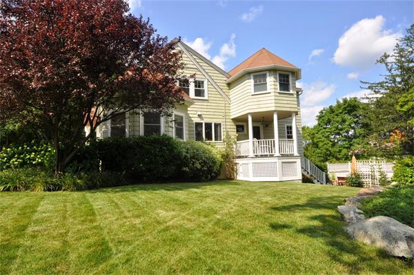 65 Columbia Road Arlington, MA 02474 - Photo 2 of 30 a front view of a house with a yard