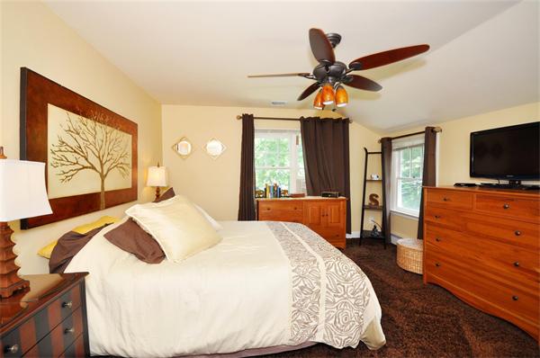 65 Columbia Road Arlington, MA 02474 - Photo 23 of 30 a bedroom with a bed and wooden floor