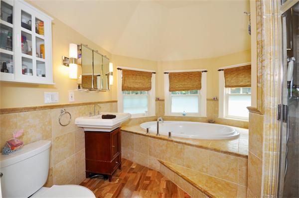 65 Columbia Road Arlington, MA 02474 - Photo 24 of 30 a bathroom with a sink mirror toilet and bathtub
