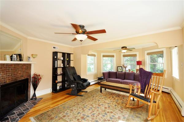 65 Columbia Road Arlington, MA 02474 - Photo 6 of 30 a living room with furniture and a fireplace