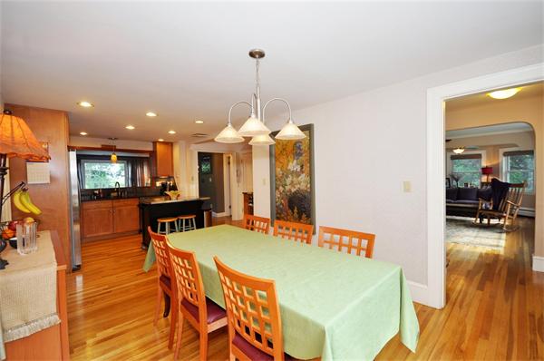65 Columbia Road Arlington, MA 02474 - Photo 8 of 30 a view of a dining room with furniture and wooden floor
