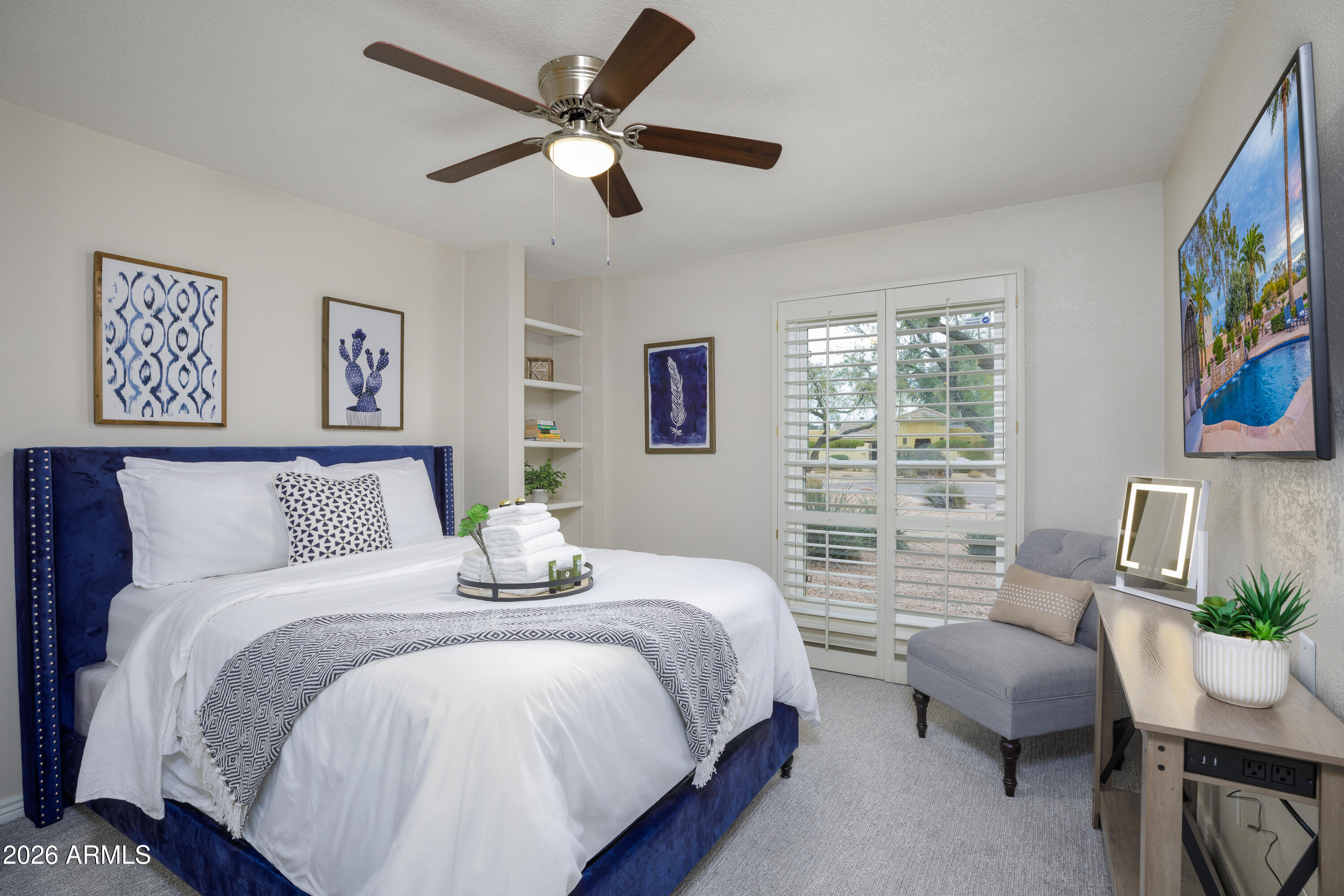 6932 East Presidio Road Scottsdale, AZ 85254 - Photo 7 of 30 a bedroom with a bed couch and a window