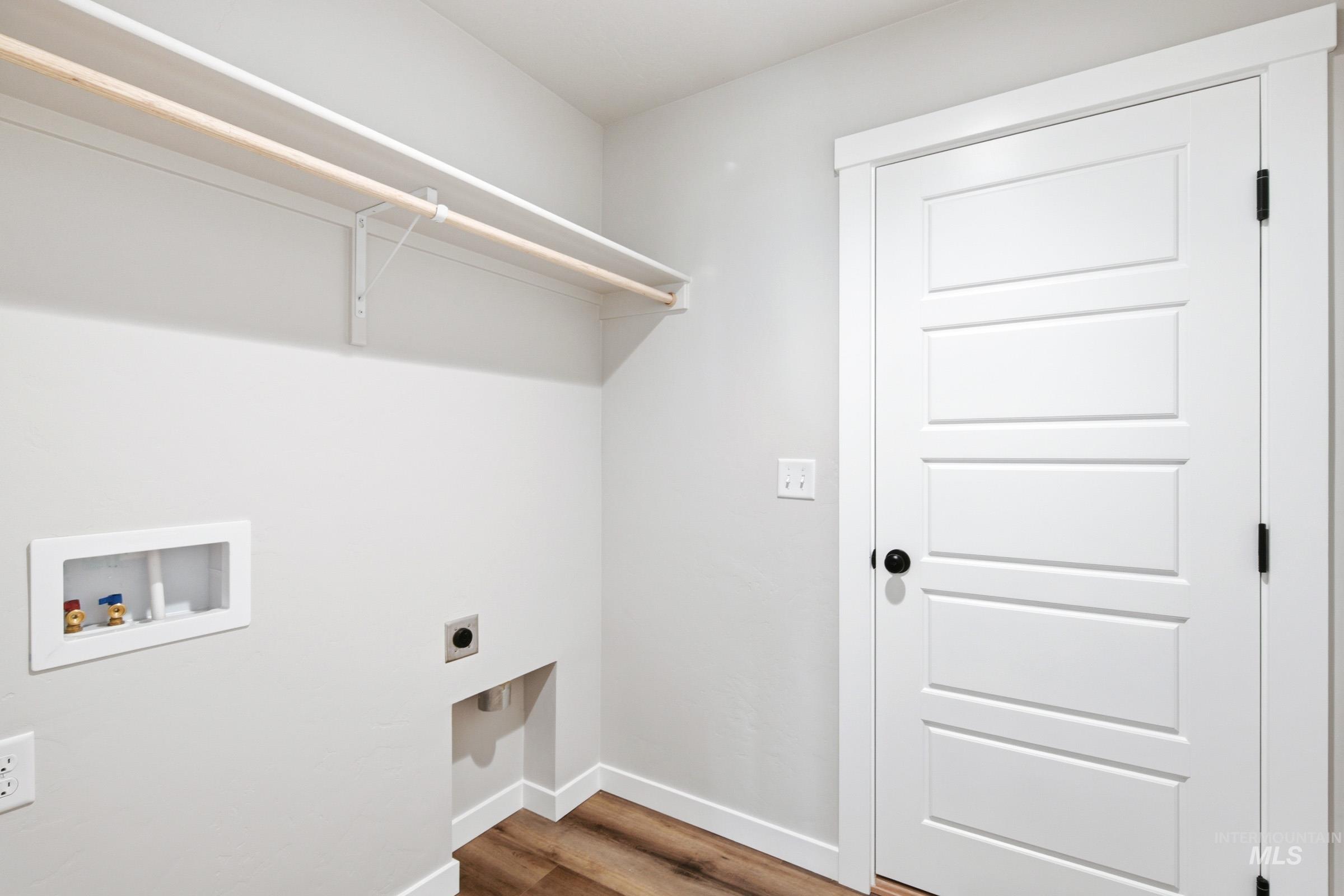 12805 Decatur Street Nampa, ID 83651 - Photo 15 of 20 Dedicated utility area featuring wood-finish flooring and light gray wall paint