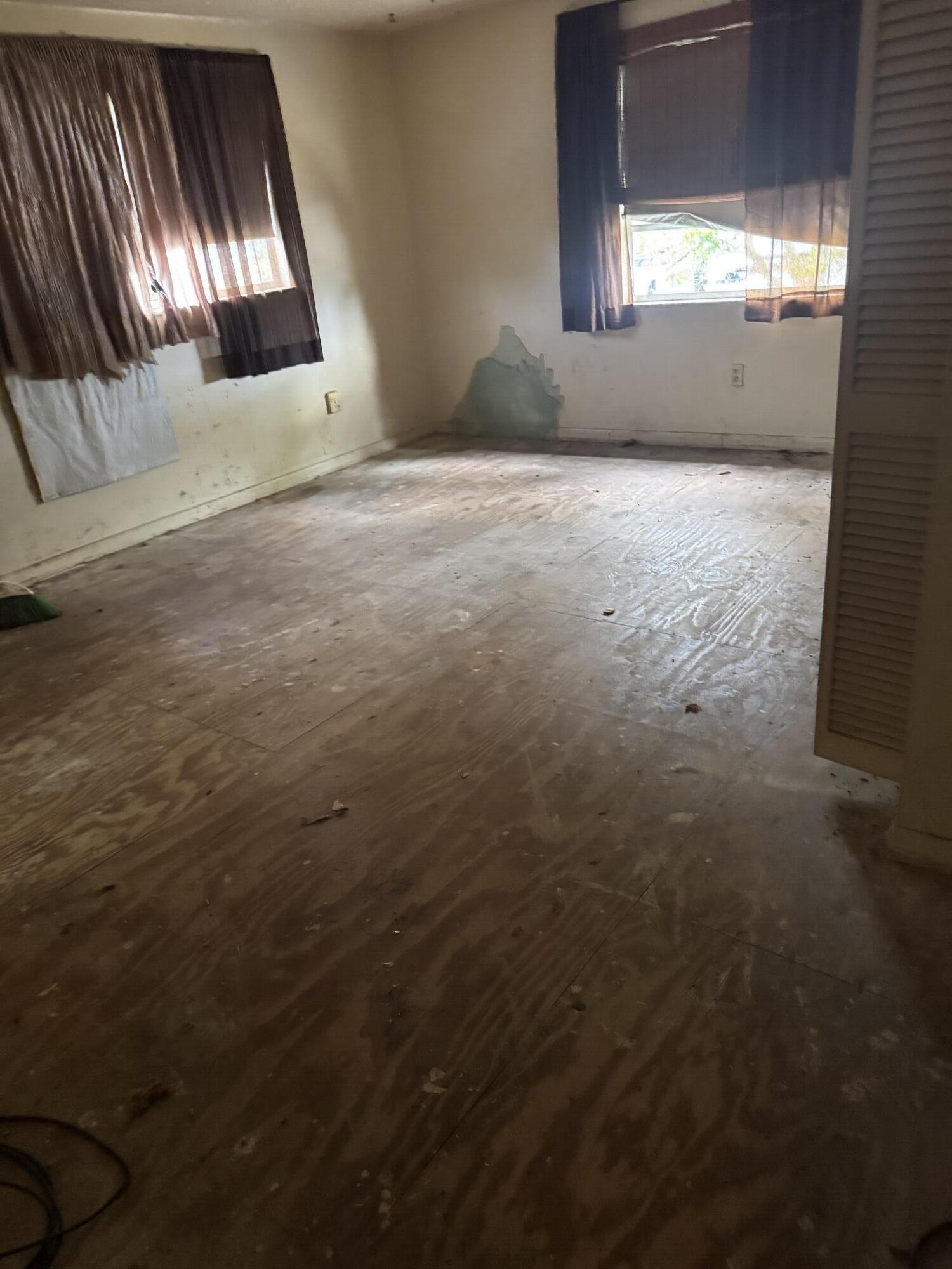 3211 Southeast Clayton Street Stuart, FL 34997 - Photo 3 of 3 a view of an empty room and window