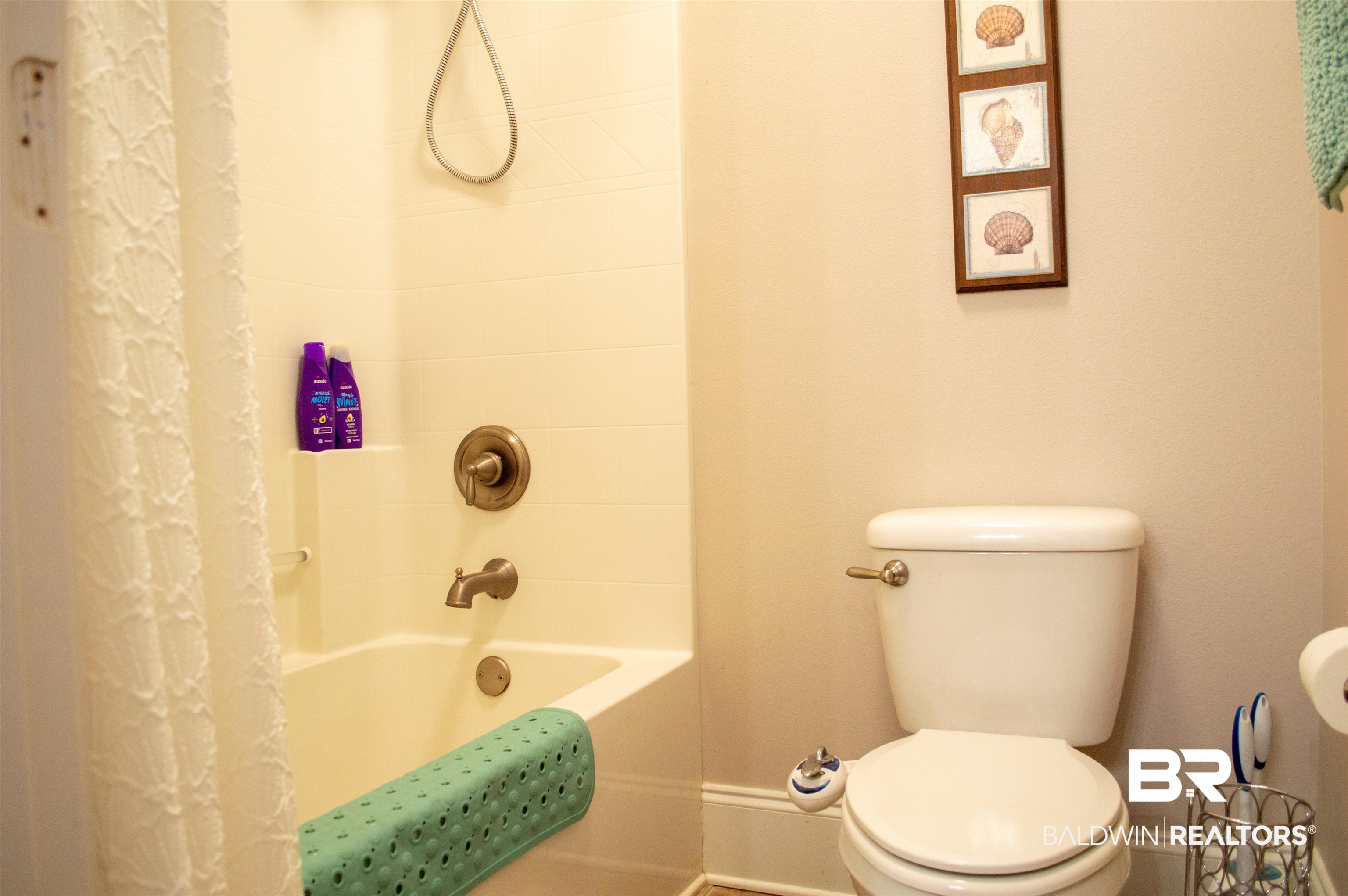 1124 West Orlando Drive Foley, AL 36535 - Photo 38 of 51 Bathroom featuring toilet and shower / tub combo