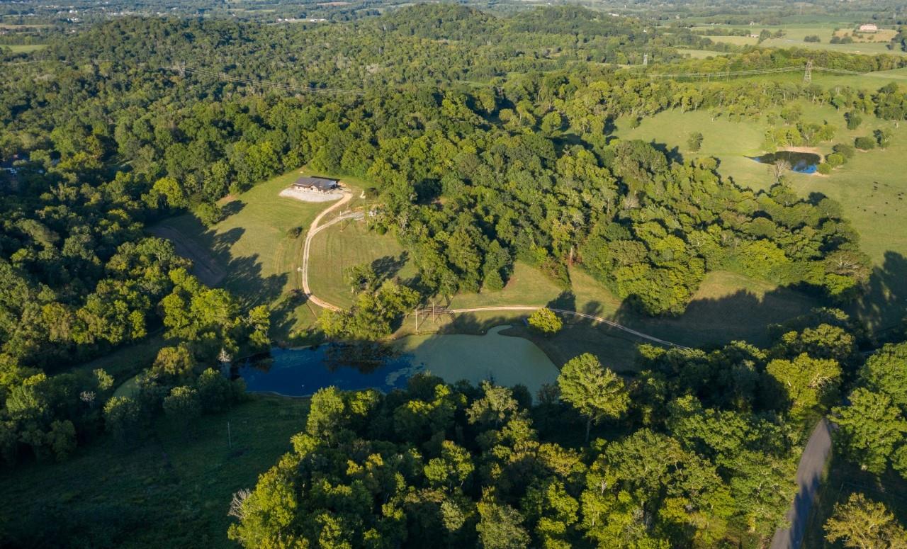 1030 Mahon Road Columbia, TN 38401 - Photo 5 of 8 Surrounded by woods and other privately owned farms. Pond being treated now for the duck weed, will be clear soon! Loaded w/ bass!
