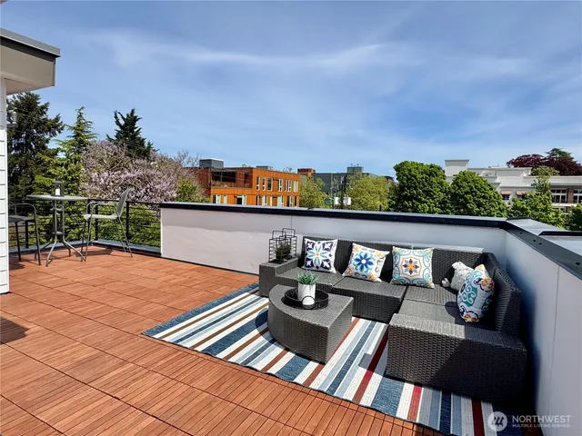 a view of roof deck with furniture