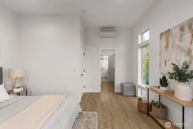 a bedroom with a bed and a table in it