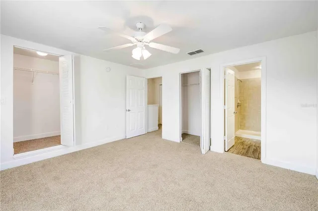 a kitchen with stainless steel appliances granite countertop a sink and a refrigerator