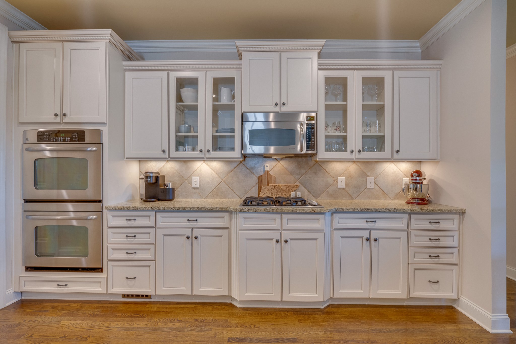 149 Keller Trail Franklin, TN 37064 - Photo 12 of 42 a kitchen with stainless steel appliances granite countertop a stove and a sink