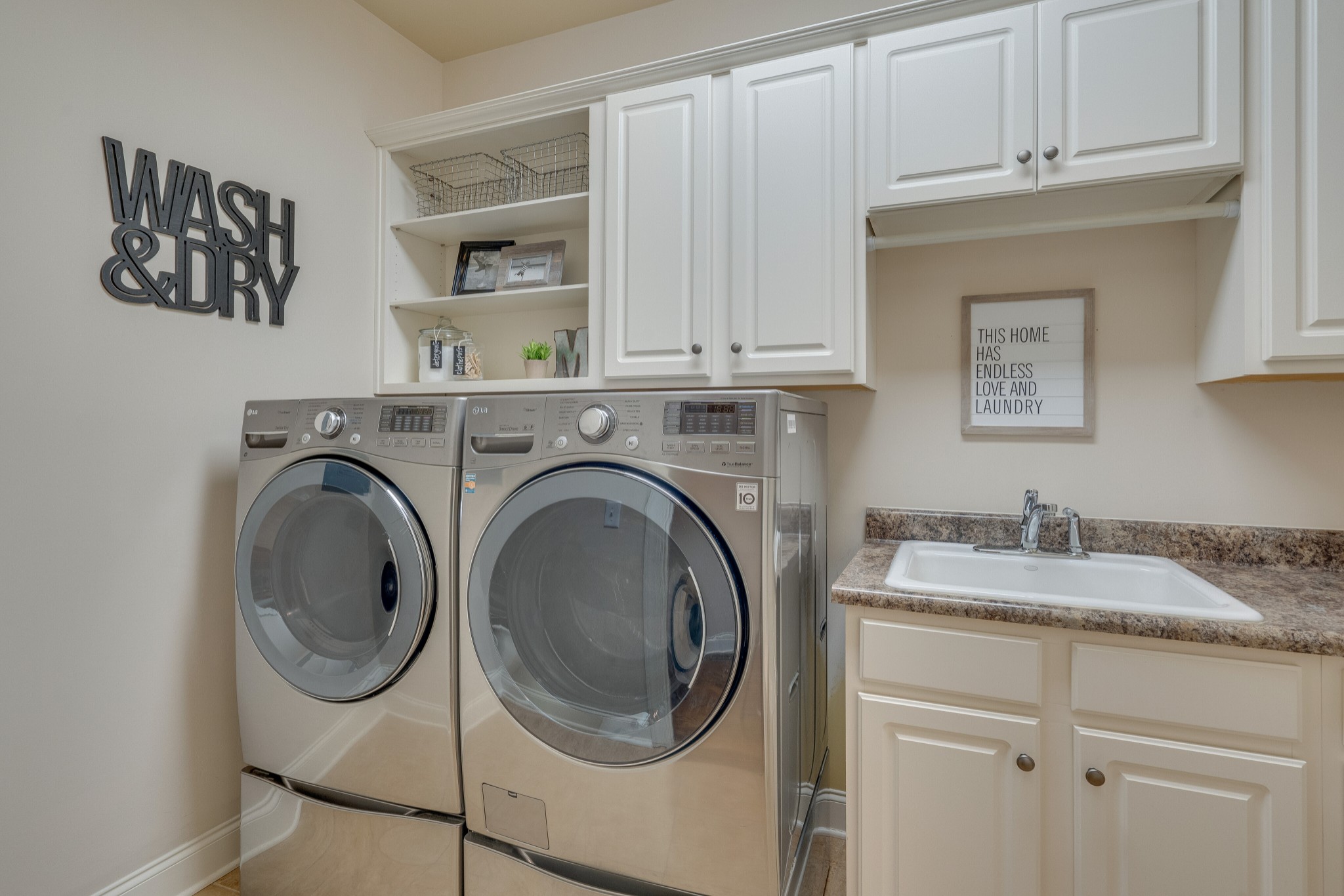 149 Keller Trail Franklin, TN 37064 - Photo 16 of 42 a utility room with sink dryer and washer