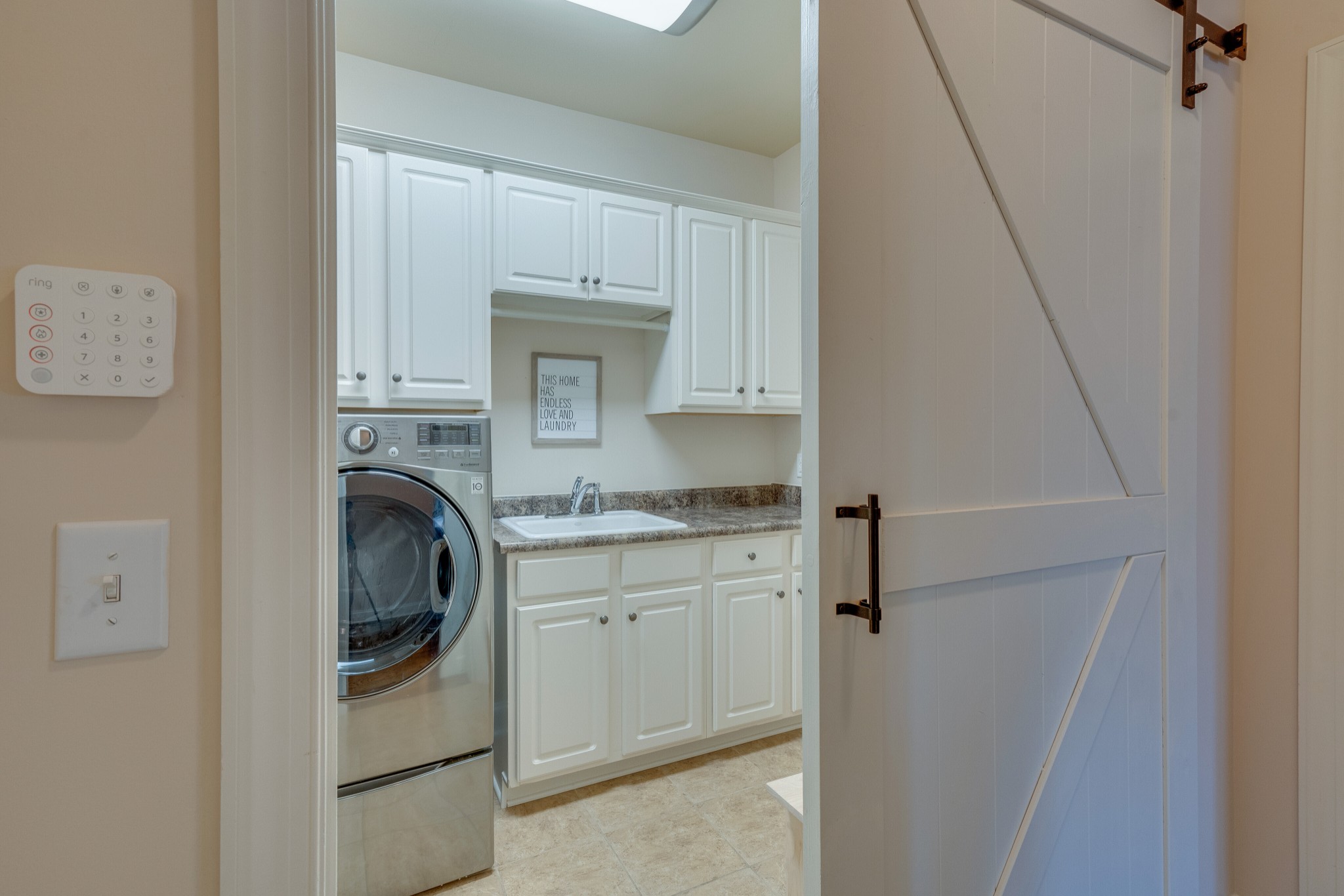 149 Keller Trail Franklin, TN 37064 - Photo 17 of 42 a utility room with cabinets washer and dryer