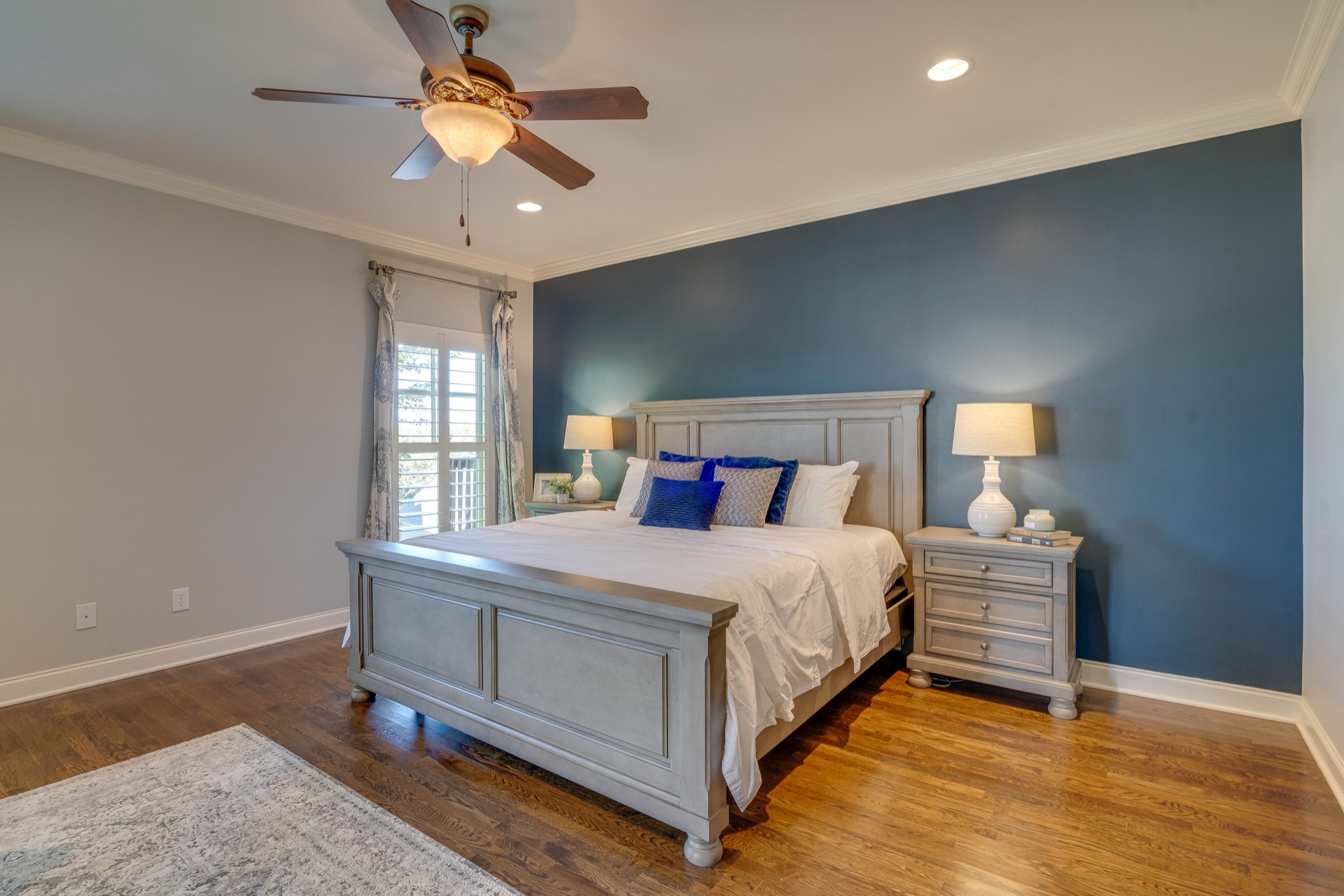 149 Keller Trail Franklin, TN 37064 - Photo 18 of 42 a bedroom with a bed and a chandelier