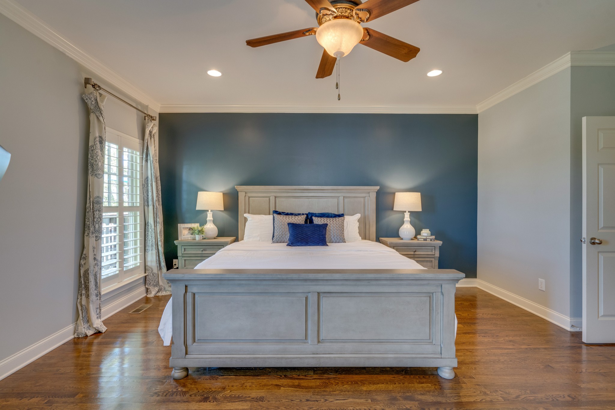 149 Keller Trail Franklin, TN 37064 - Photo 19 of 42 a bedroom with a bed and a chandelier