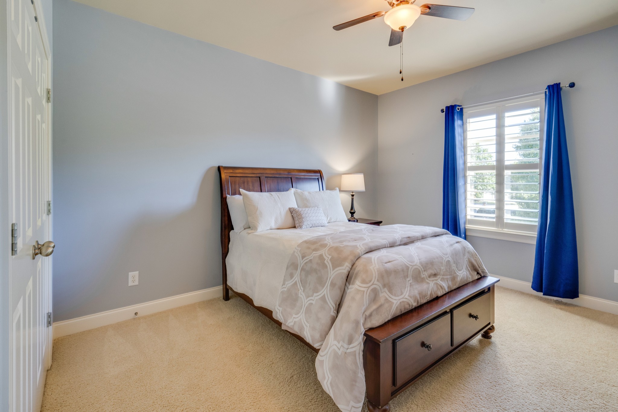 149 Keller Trail Franklin, TN 37064 - Photo 32 of 42 a spacious bedroom with a bed and a chandelier