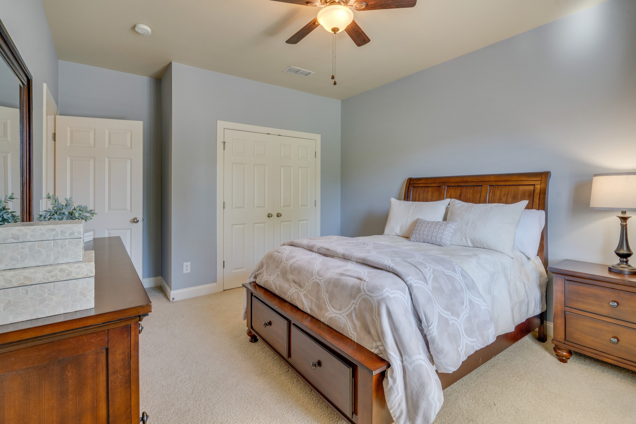149 Keller Trail Franklin, TN 37064 - Photo 33 of 42 a bed room with a bed and a chandelier
